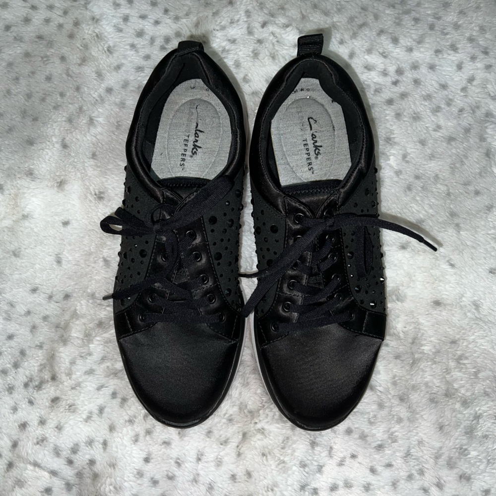 Clerks’s black sparkly sneakers